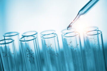 Closeup of Scientists use a chemical dropper into a test tube during an experiment in a science...
