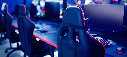 Professional gamers cafe room with powerful personal computer game chair blue color. Concept cyber...
