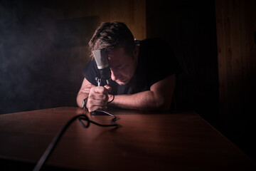 Serious reporter in television studio looking at the camera