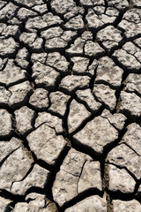 Part of a huge area of dried land suffering from drought in cracks.