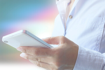Woman hand holding smart phone with graphic icon multichannel online banking