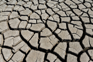 Part of a huge area of dried land suffering from drought in cracks.