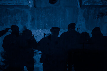 Shadow of soldiers on wall at night. Army concept. Fighting silhouettes on colored stone wall