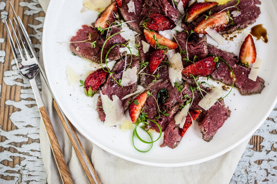 Beef carpaccio with strawberries