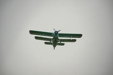 An-2 plane flies through the sky