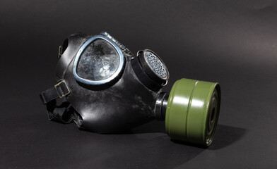 Vintage gasmask isolated on black - Green filter
