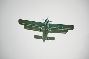 An-2 plane flies through the sky
