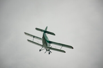 An-2 plane flies through the sky