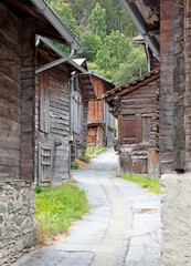 Fototapeta na wymiar Street with very old cabins in Switzerland