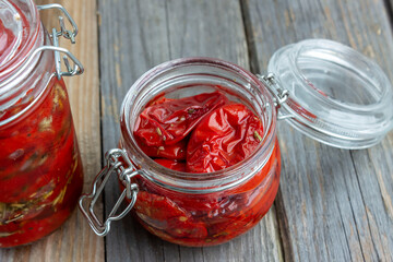 dried tomatoes in a jar in spiced oil.