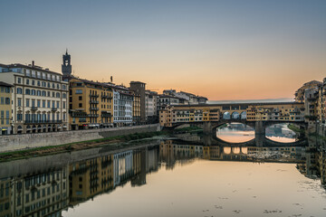 Sunrise at Ponte Vecchio bridge over Arno river in Florence, Italy.