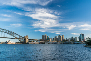 Obraz premium Sydney harbor bridge with Sydney downtown skyline, in the afternoon, New South Wales, Australia