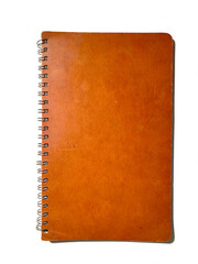 isolated brown worn retro vintage antique spiral notebook on white background