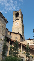 Fototapeta na wymiar Bergamo, Italy. The old town. Landscape at the clock tower called Il Campanone. It is located in the main square of the upper town. Bergamo one of the most beautiful in Italy