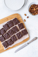 Chocolate fudge with nuts on a gray background. Homemade dark chocolate brownies.