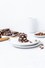 Chocolate fudge with nuts on a gray background. Homemade dark chocolate brownies.