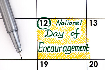 Reminder National Day of Encouragement in calendar with pen