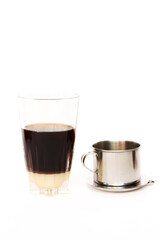 'Phin' traditional Vietnamese coffee maker, place on the top of glass, add ground coffee then pour hot water and wait until the coffee dripping into the glass with condensed milk at the bottom.