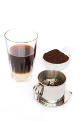 'Phin' traditional Vietnamese coffee maker, place on the top of glass, add ground coffee then pour hot water and wait until the coffee dripping into the glass with condensed milk at the bottom.
