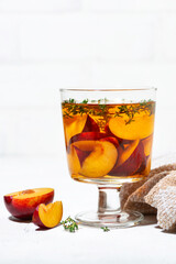 black tea with plum and thyme, vertical closeup