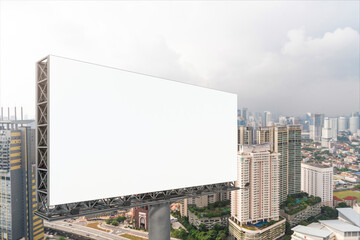 Blank white road billboard with KL cityscape background at day time. Street advertising poster, mock up, 3D rendering. Side view. The concept of marketing communication to promote or sell idea.