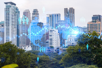 Social media icons hologram over panorama city view of Bangkok, Asia. The concept of people networking and connections. Double exposure.
