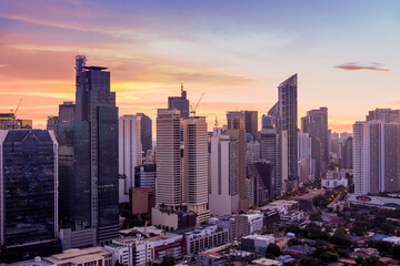 Makati, Metro Manila, Philippines - Sept 2020: Beautiful skyline at sunset. View of Office...