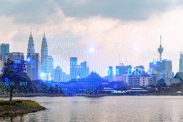 Fototapeta na wymiar Glowing hologram of Earth planet map on aerial panoramic cityscape of Kuala Lumpur at sunset, Malaysia, Asia. The concept of international business in KL. Multi Exposure.
