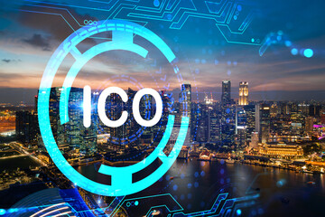 Hologram of glowing ICO icon, sunset panoramic city view of Singapore, startup incubator of cryptocurrency projects in Asia. The concept of affordable opportunities in new era. Double exposure.