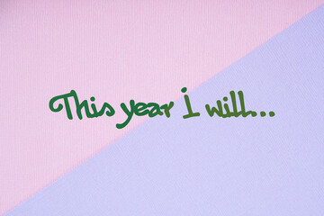 Motivational quote on a pink and blue background. This year I will...