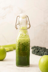 Healthy green smoothie with green fruits and vegetables. Detox, dieting, clean eating.