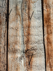 Closeup on old damaged wooden boards wall texture