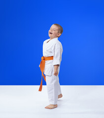 Cheerful sportsman with an orange belt