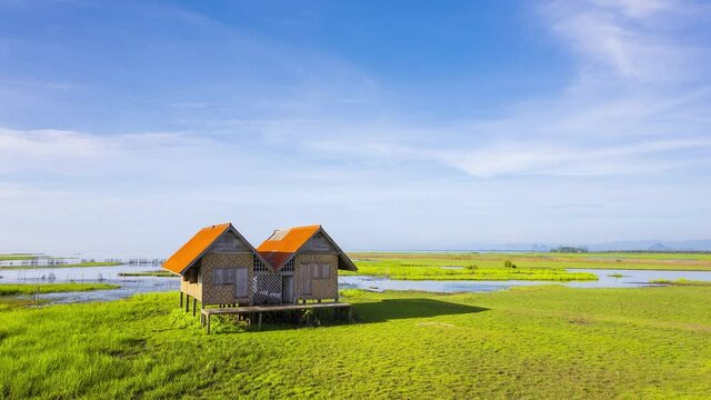 4K time lapse of alone abandoned house the landmark of Thale noi wetland in Phatthalung province, Thailand