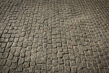 the road is made of stone granite paving stones