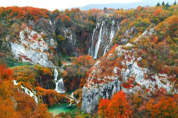 Famous Plitvice lakes with beautiful autumn colors and magnificent views of the waterfalls at ...