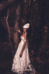 Fototapeta premium Creepy Halloween female portrait with mask