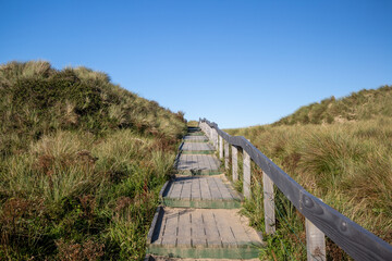 Fototapeta na wymiar wooden walk way over beach