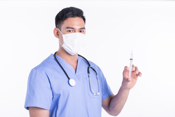 Asian male doctor wearing mask and using syringe for virus protection