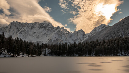 Frozen lake of fusine in a sunny afternoon, Friuli-Venezia Giulia, Italy