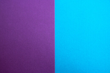 Blue-purple background of matte suede, close-up. Velvety texture