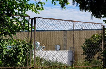 industrial area behind the fence.