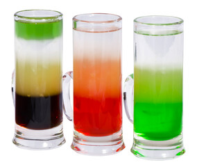Three alcoholic cocktail shot in a glass on a white background