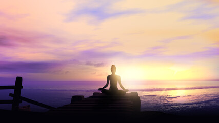 Girl meditating to the sound of sea waves.