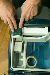 The process of cleaning a room with a vacuum cleaner with an aquafilter. Installing a clean...