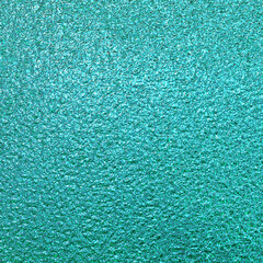 Teal green blue foil paper texture background.