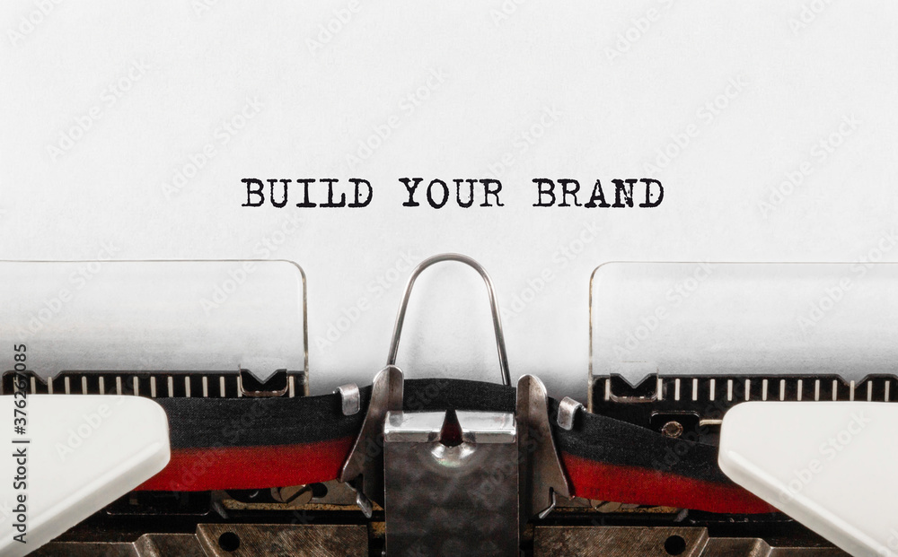 Poster text build your brand typed on typewriter