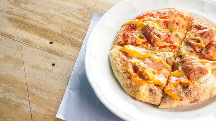 delicious pizza detail on white plate close up view