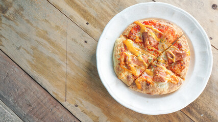 top view mini pizza on wooden bacground
