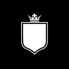 Icon of shield and crown isolated on dark background